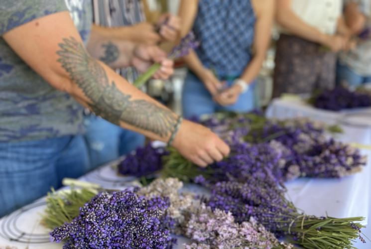 Close up view of bundled lavender on a white tablecloth